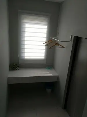 a window in a room with a bench in front of it at Check-Inn Guesthouse in Ipoh