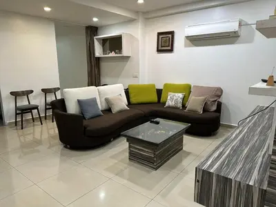 a living room with a couch and a table at Double Storey House at Raja Uda with 3 rooms in Butterworth