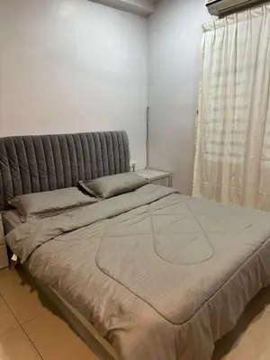 a large bed in a room with a window at Double Storey House at Raja Uda with 3 rooms in Butterworth