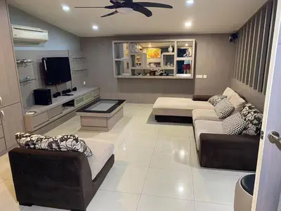 a living room with two couches and a tv at Double Storey House at Raja Uda with 3 rooms in Butterworth