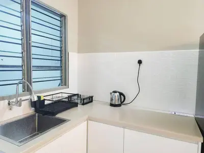 a kitchen with a sink and a toaster on the counter at IPOH MENGLEMBU LOHAS 4BR3Bath14 PAX in Ipoh