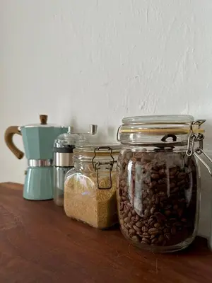 a table with jars of coffee beans and a blender at The Gaslight Heritage Residence - NEW in George Town