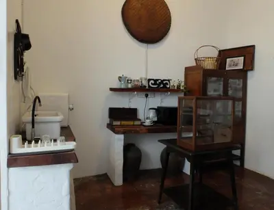 a bathroom with a sink and a counter with a table at The Gaslight Heritage Residence - NEW in George Town
