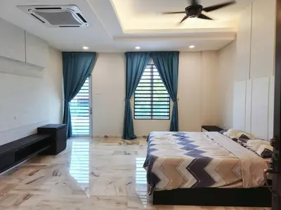 a bedroom with a bed and a ceiling fan at 10Min to IPOH TOWN 4BR20PAX MAHJONG GAME KARAOK in Ipoh