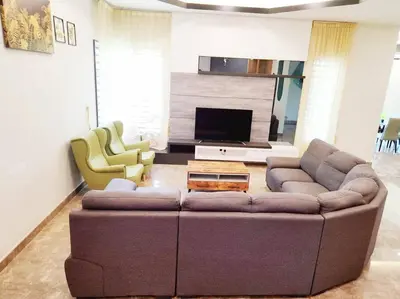 a living room with a couch and two chairs at 10Min to IPOH TOWN 4BR20PAX MAHJONG GAME KARAOK in Ipoh