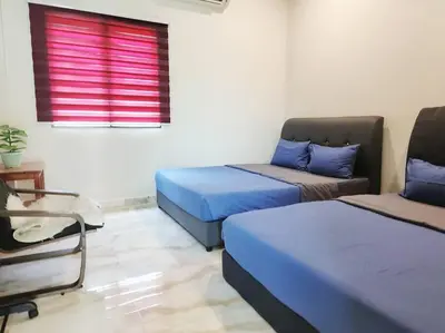 a room with two beds and a couch and a window at 10Min to IPOH TOWN 4BR20PAX MAHJONG GAME KARAOK in Ipoh