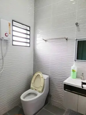 a white bathroom with a toilet and a sink at 10Min to IPOH TOWN 4BR20PAX MAHJONG GAME KARAOK in Ipoh