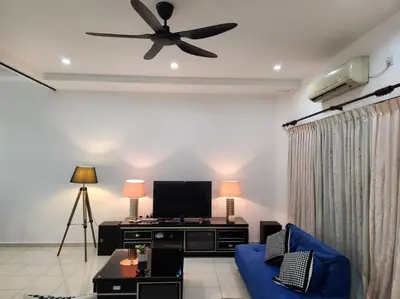 a living room with a blue couch and a ceiling fan at 10min to IPOH town GEMILANG TAWAS 4br4bath 14pax in Ipoh