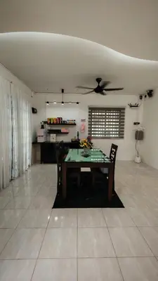 a dining room with a table and a ceiling fan at 23 Inn Singlebed Share Bathroom No Window in Bukit Mertajam
