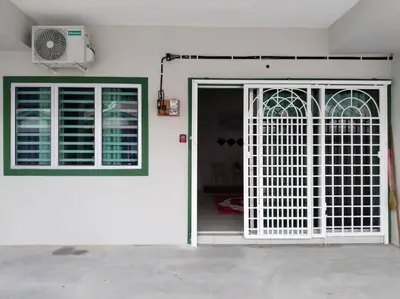 a white door and window in a white house at Homestay Arora Teluk Intan in Teluk Intan