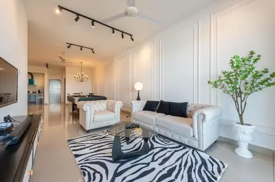a living room with two couches and a zebra rug at Serene French Family Retreat with Sunrise View in Cameron Highlands