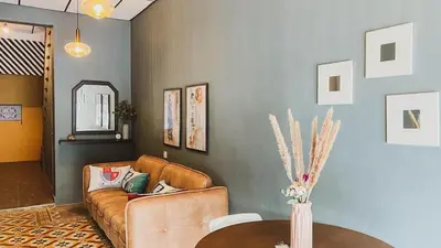 a living room with a couch and a table at Georgetown Cozy 7 Bedrooms 13 Pax in George Town