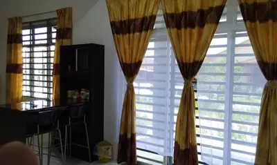 a room with two windows with curtains at AL DHAKIYA HOMESTAY KULIM 3r2b in Kulim