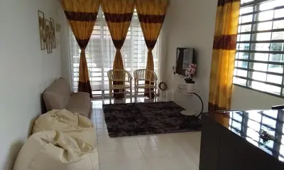 a living room with a couch and chairs and a tv at AL DHAKIYA HOMESTAY KULIM 3r2b in Kulim