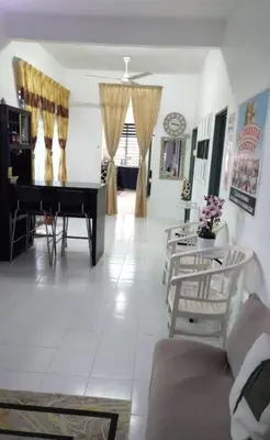 a living room with a piano and a table at AL DHAKIYA HOMESTAY KULIM 3r2b in Kulim