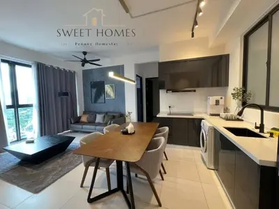 a kitchen and a living room with a table in a kitchen at Urban Modern3BR CityView 7pax Infinity Pool in George Town