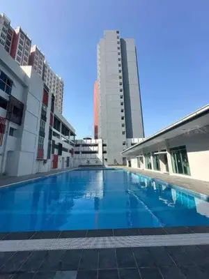 a large swimming pool in a city with tall buildings at The Anderson Ipoh in Ipoh
