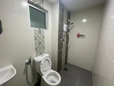 a small bathroom with a toilet and a sink at The Anderson Ipoh in Ipoh