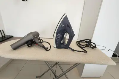 a desk with a hair dryer and a blow dryer at IPOH City Horizon08 - 8 mins to Concubine Lane and Old Town Ipoh, 3 mins Walking to Food Places & Convenient Store by Happy Homestay in Ipoh