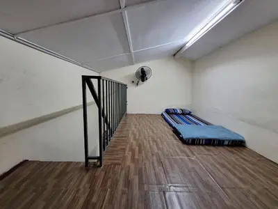 a room with a bed in the middle of a room at Mukhriz 2 Homestay in Kulim