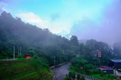 a view of a mountain with a river and trees at Cozy Homestay at Tanah Rata - Moonshot Highlanders in Tanah Rata