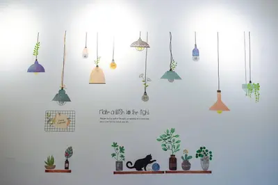 a group of potted plants and potted plants on a wall at Cozy Homestay at Tanah Rata - Moonshot Highlanders in Tanah Rata