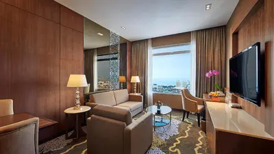 a hotel room with a living area with a television at St Giles Wembley Penang in George Town