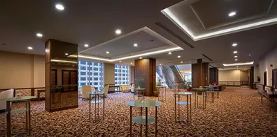 a lobby with tables and chairs in a building at St Giles Wembley Penang in George Town