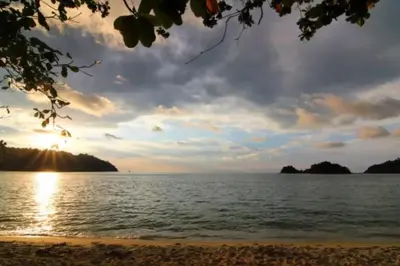 a view of the ocean at sunset at De Clinique Hotel in Pangkor