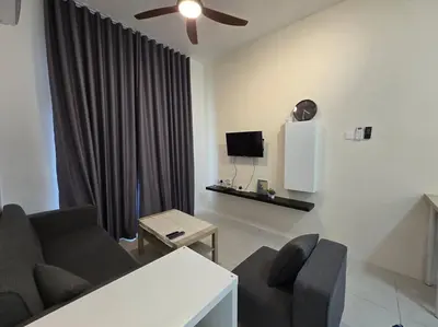 a living room with a couch and a tv at Stay at Anderson Condo 161 Ipoh Town FREEWIFITVBOX in Ipoh
