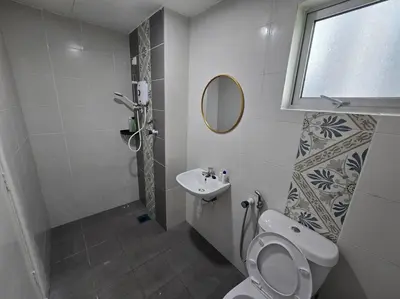 a bathroom with a toilet and a sink at Stay at Anderson Condo 161 Ipoh Town FREEWIFITVBOX in Ipoh