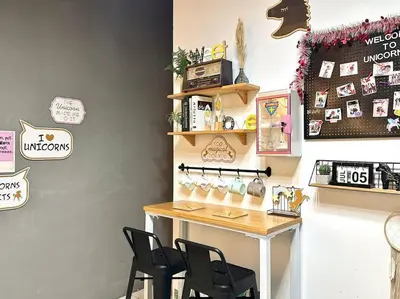 a room with a table and chairs in it at Unicorn Fairy Theme 2BR Airport Suite# Straits Intl# Pantai Hospt in Bayan Lepas