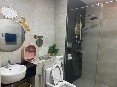 a bathroom with a shower and a toilet and a sink at Unicorn Fairy Theme 2BR Airport Suite# Straits Intl# Pantai Hospt in Bayan Lepas