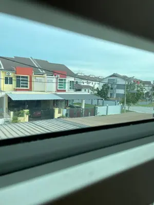 a view of a building from a window at Zara Cozy Homestay in Seri Iskandar