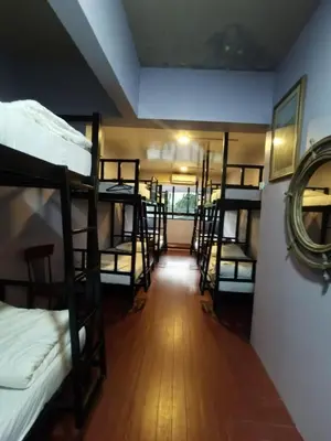 a hallway with several bunk beds in a room at Grand Star Hotel in Batu Ferringhi