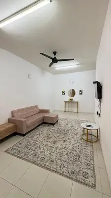 a living room with a couch and a rug at Home-Away Homestay in Gerik