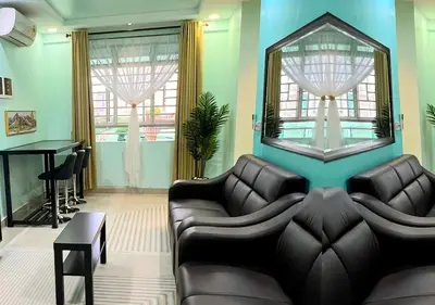 a living room with a couch and a table at Homestay Pulau Pinang Urban Sky Guesthouse in Bayan Lepas