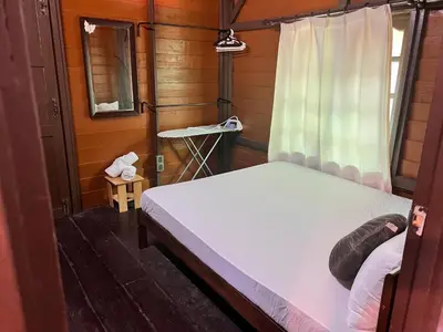 a small room with a bed and a window at Homestay Jasmin in Taiping
