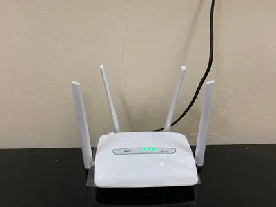 an electronic device sitting on a table next to a wall at No 115 Homestay Tasik Raban Lenggong in Kampong Kuala Chegar