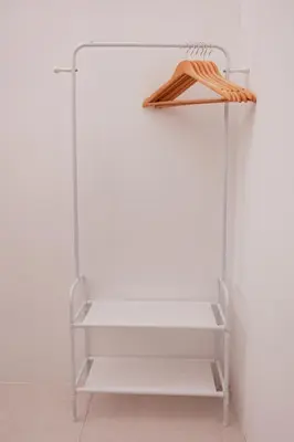 a white shelf with a wooden umbrella on it at Taiping Homestay 5R3B, 9mins - Zoo & Lake Garden Taiping in Taiping