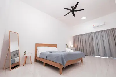 a bedroom with a bed and a ceiling fan at Taiping Homestay 5R3B, 9mins - Zoo & Lake Garden Taiping in Taiping