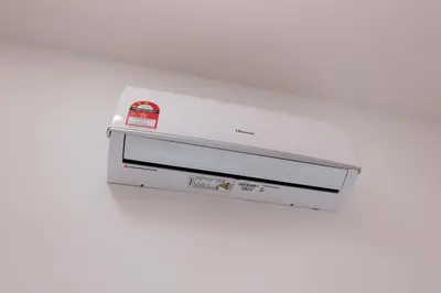a dvd player is on a white wall at Taiping Homestay 5R3B, 9mins - Zoo & Lake Garden Taiping in Taiping