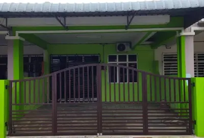 a front porch of a green house with a wooden railing at Lily Impiana Homestay in Baling