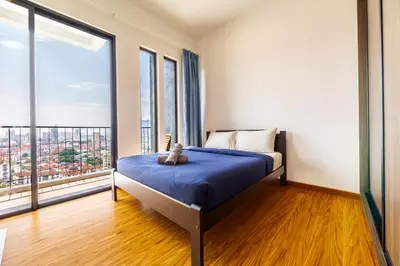a bedroom with a bed with a teddy bear on it at Beacon Suites #Georgetown #Rooftop Pool #20 #Cozy in George Town