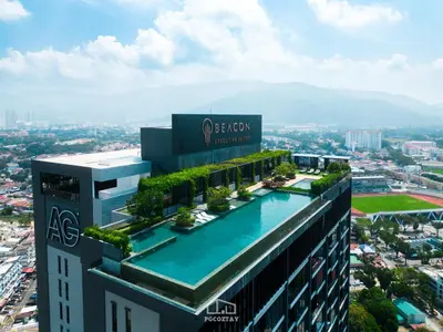 a building with a swimming pool on top of it at Beacon Suites #Georgetown #Rooftop Pool #20 #Cozy in George Town
