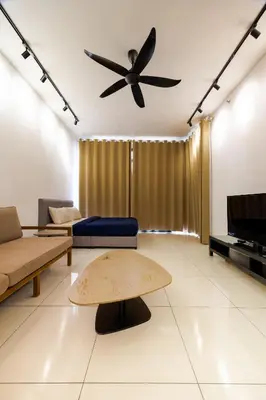 a living room with a couch and a ceiling fan at Beacon Suites #Georgetown #Rooftop Pool #20 #Cozy in George Town