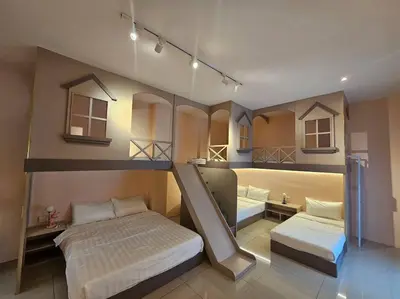 a bedroom with two bunk beds and a mirror at jia Residence 21 pax Karaoke & Snooker in Ipoh