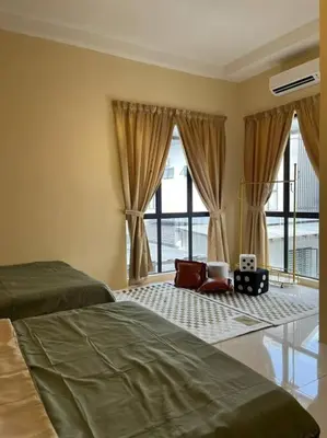a bedroom with a bed and a large window at Happiness Stay 20pax Karaoke & Snooker in Ipoh