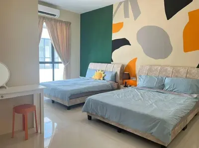 a bedroom with two beds and a table and a couch at Happiness Stay 20pax Karaoke & Snooker in Ipoh