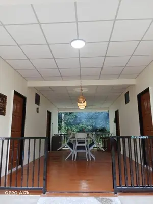 an empty room with a table and chairs in it at Bilik Umairah in Gerik